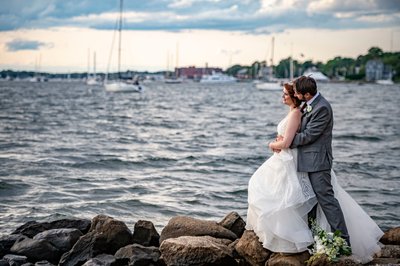 Couple by waterfront Blithewold Mansion wedding portraits