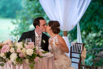 Bride and groom kiss Blithewold Mansion wedding reception