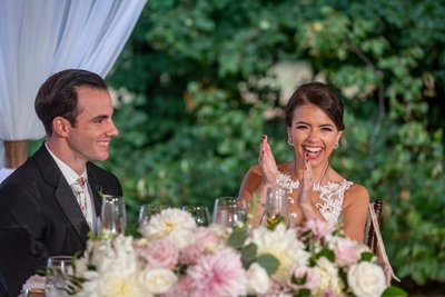 Groom and bride laughing Blithewold Mansion wedding reception