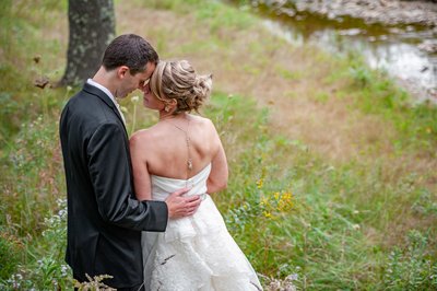 bride-groom-intimate-moment-riverside-farm-vermont