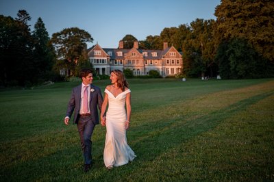 Blithewold Mansion wedding couple walking the great lawn