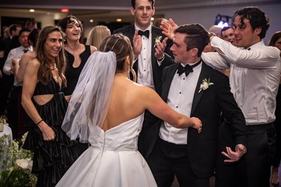 Couple surrounded by friends on the dancefloor