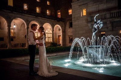 Night portrait of a couple in the McKim Courtyard at the Boston Public Library.