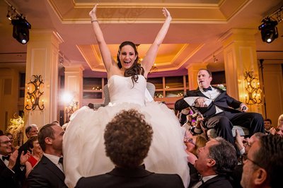 Ecstatic bride during the hora dance at The Boston Harbor Hotel.