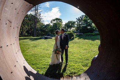 Bride and Groom Framed by Sculpture at deCordova Museum Weddings