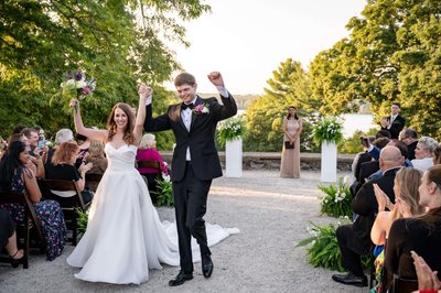 Bride and groom celebrating post-ceremony at deCordova Museum weddings