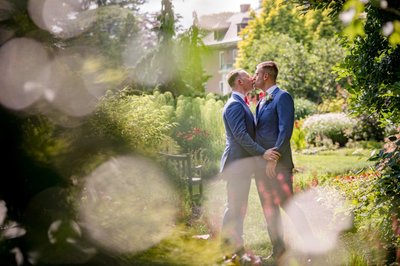 Soft golden light on same-sex couple at Elm Bank weddings