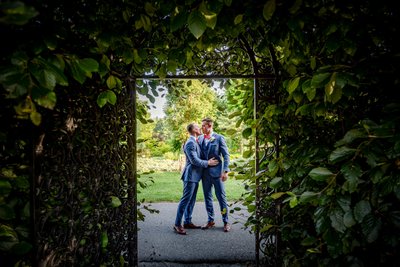 Intimate moment between two grooms at Elm Bank wedding