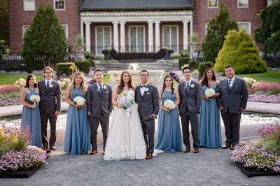 Wedding party in front of historic mansion at Elm Bank weddings