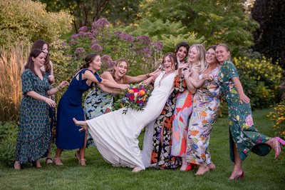 Playful wedding party celebration at an Elm Bank weddings venue