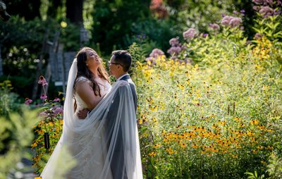 Elm Bank weddings candid moment among the flowers