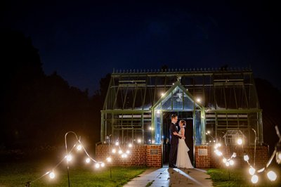 Nighttime greenhouse portrait at Elm Bank weddings