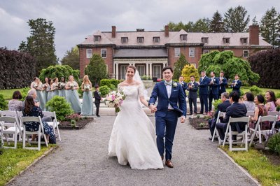 Wedding ceremony in front of the mansion at Elm Bank