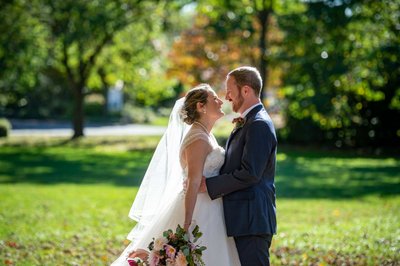 Bride and groom sharing a joyful moment at Elm Bank weddings