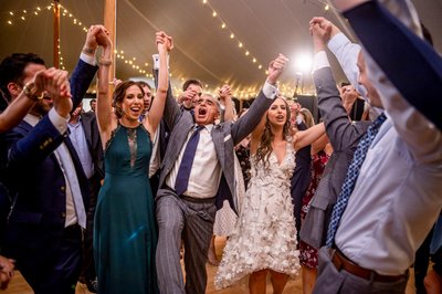 Fun wedding reception moment with guests dancing at Elm Bank weddings