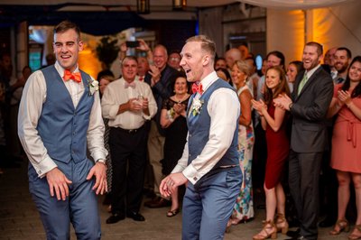 Grooms rocking out during their reception at Elm Bank