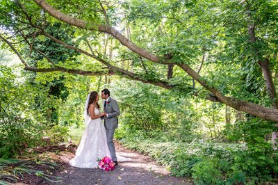 Romantic wedding portrait surrounded by lush greenery at Elm Bank weddings