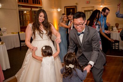 Bride and groom dancing with kids at their Elm Bank wedding reception