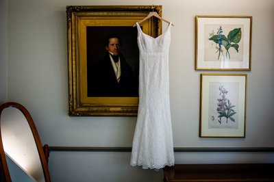 Wedding dress hanging in elegant room at Elm Bank venue