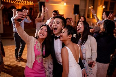 Wedding guests selfie on the dance floor at Elm Bank weddings