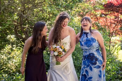 Bride laughing with bridesmaid at Long Hill wedding in MA