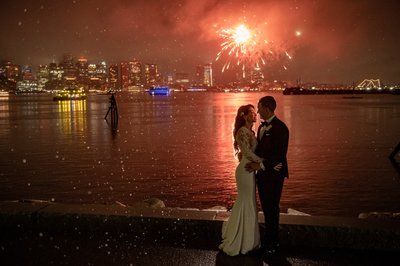 Epic wedding couple fireworks kiss over the Boston Harbor