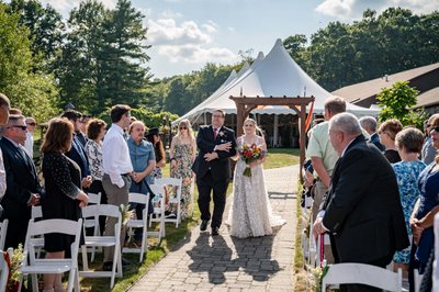 Bride and her dad walking down the aisle at Fern Hill Barn