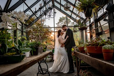 Sunset greenhouse wedding portrait at Fern Hill Barn