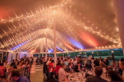 Vibrant tent lighting during the Fern Hill Barn reception