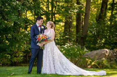 Bride and groom in the woods at Fern Hill Barn