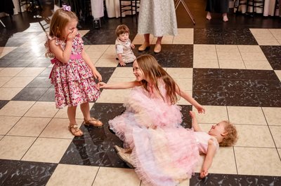 Kids dancing on checkered floor – Fern Hill Barn reception