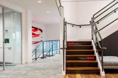 Corporate stairway interior with brand signage