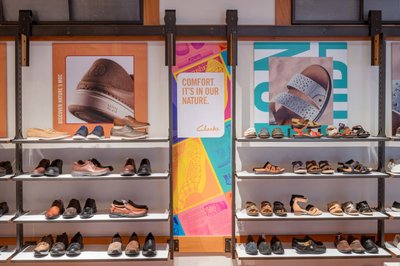 Retail shoe wall display visual merchandising photo