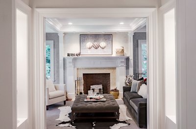 Traditional living room with custom fireplace and millwork