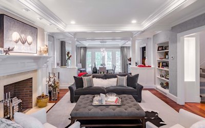 Open living room with fireplace and neutral decor