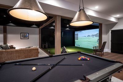 Modern billiards room with pendant lighting and virtual golf