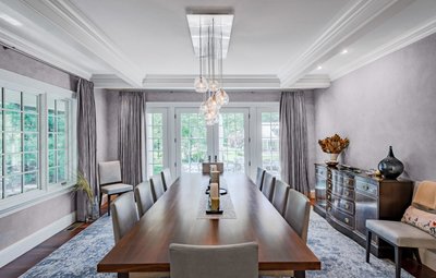 Formal dining room with wainscoting and chandelier
