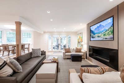 Open concept living and dining room with modern fireplace