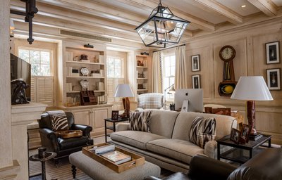 Rustic living room with exposed beams and leather seating