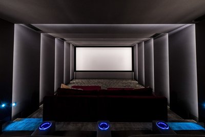 Home theater room with ambient lighting and recliners