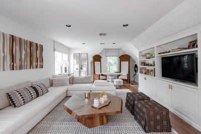 Neutral toned living room with wood accents and soft textures