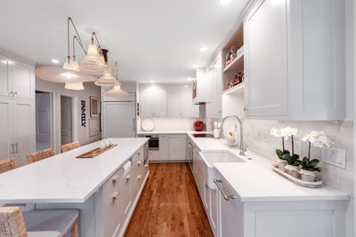 Bright kitchen with glass cabinets and island seating