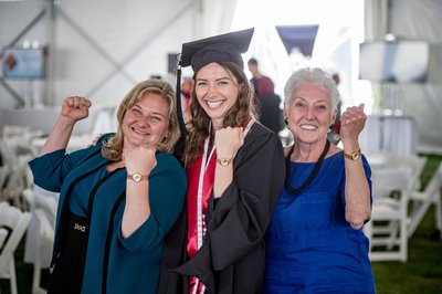 Graduate and family celebrating joyfully at Boston commencement