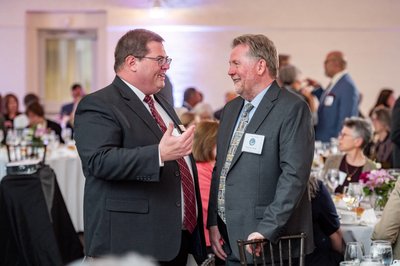 Professional networking moment at Boston corporate event