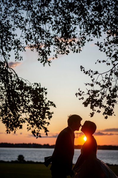 Golden hour kiss Blithewold Mansion wedding couple