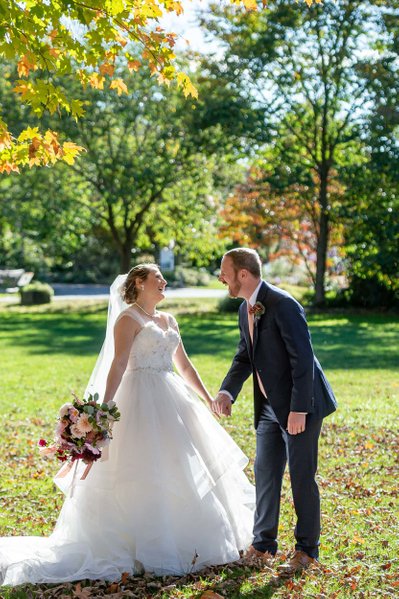 Newlyweds twirling on the lawn at Elm Bank weddings