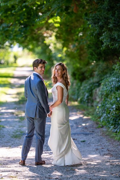 Bride and groom walking path Blithewold Mansion wedding