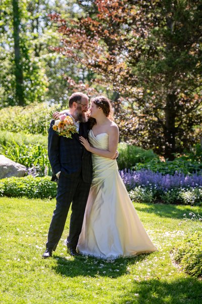 First kiss as newlyweds at Long Hill wedding in Beverly