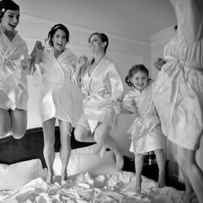 Fairmont hotel bride with flower girl jumping on bed