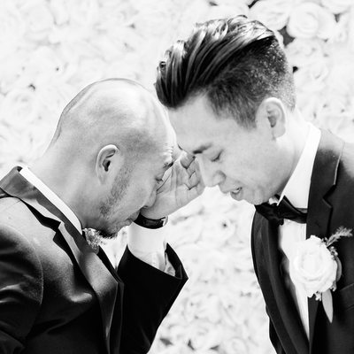 Crying groom and best man at wedding ceremony in Bali